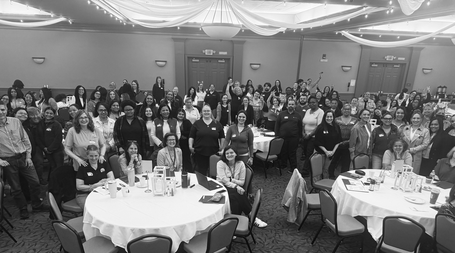 A large, engaged group gathered for a facilitated learning experience