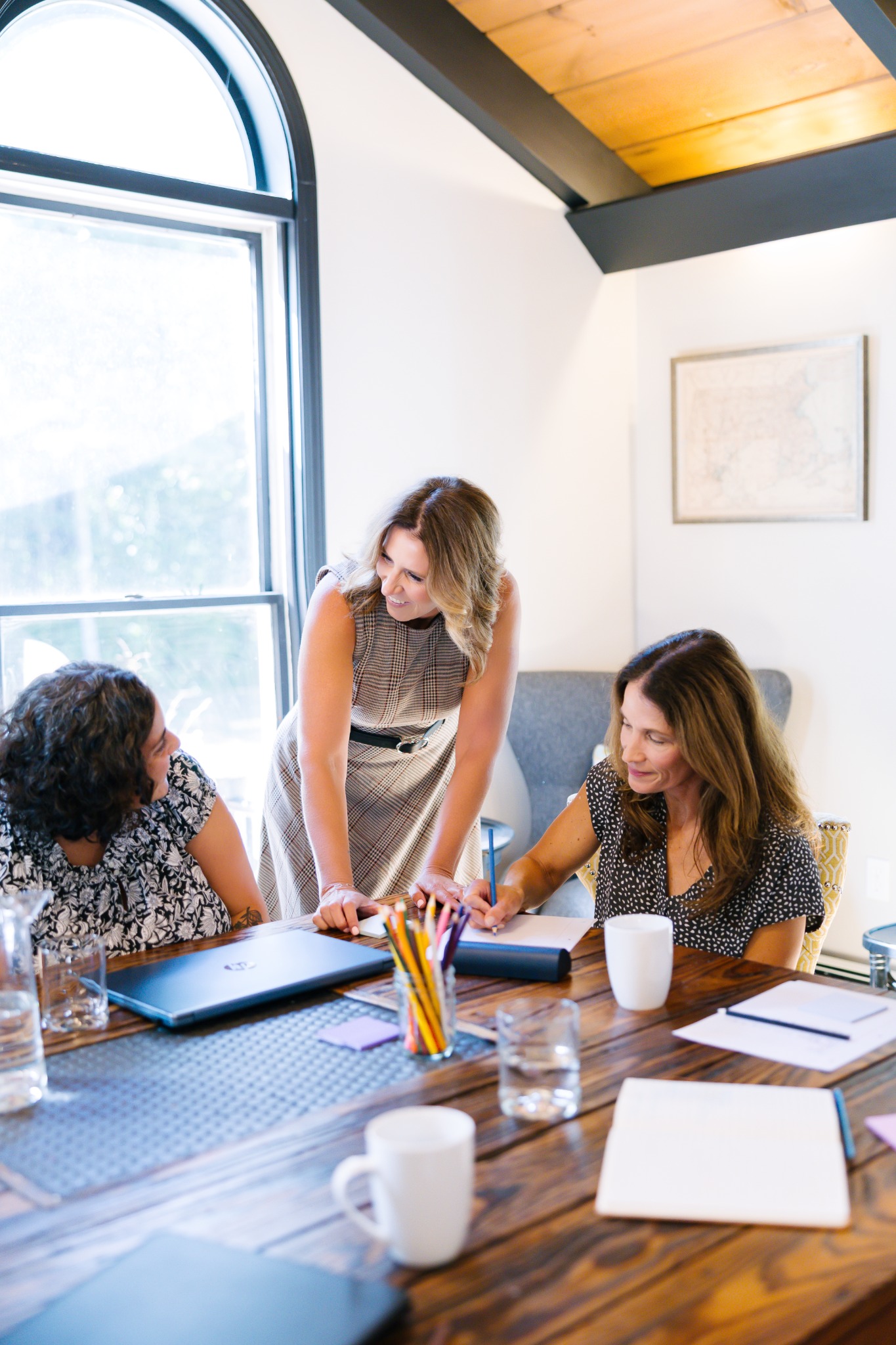 Laura Crosby coaching participants during a small-group learning activity